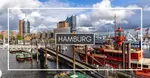 View of Hamburg harbor with boats docked along the water, modern buildings in the background, and a cloudy sky overhead. The word "Hamburg" is centered on the image.