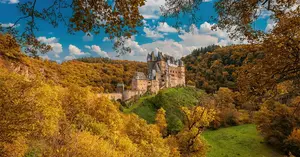 Eltz Castle surrounded by autumn foliage in Germany, October travel destination