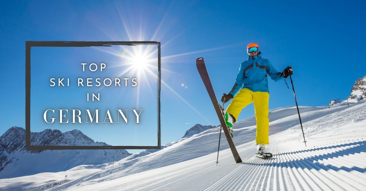 A skier posing on the slopes of Zugspitze mountain in Germany with the sun shining