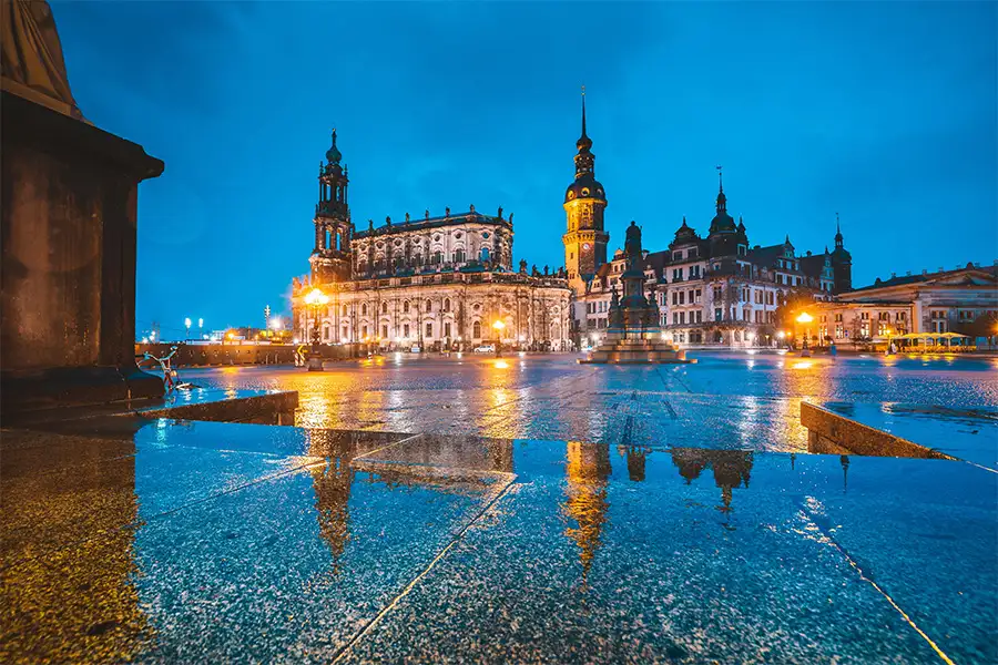 Dresden’s historic Old Town reflecting on wet cobblestones after autumn rain