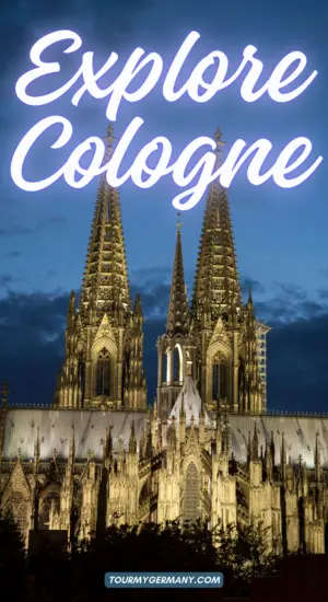 Cologne Cathedral at night, lit up in lights.
