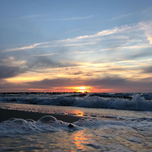 Waves on the sea with sunset in background  (Kühlungsborn)