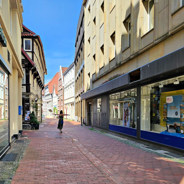 Lydia dancing down the cobblestone streets of Hamelin