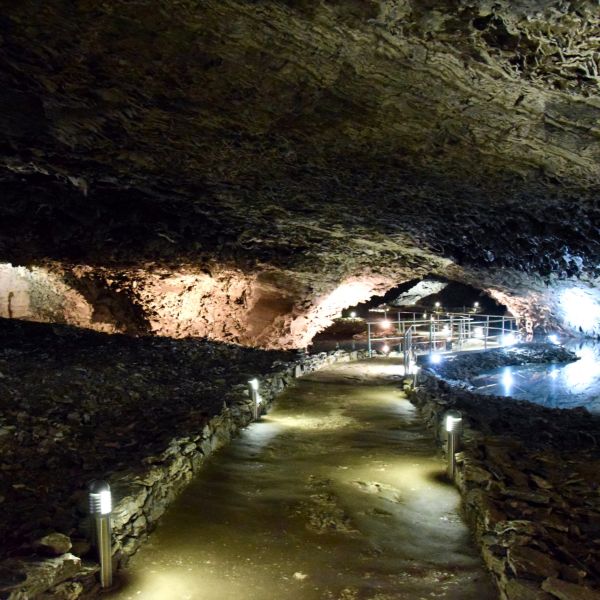 Dark cave with path by the water Dark cave with path by the water