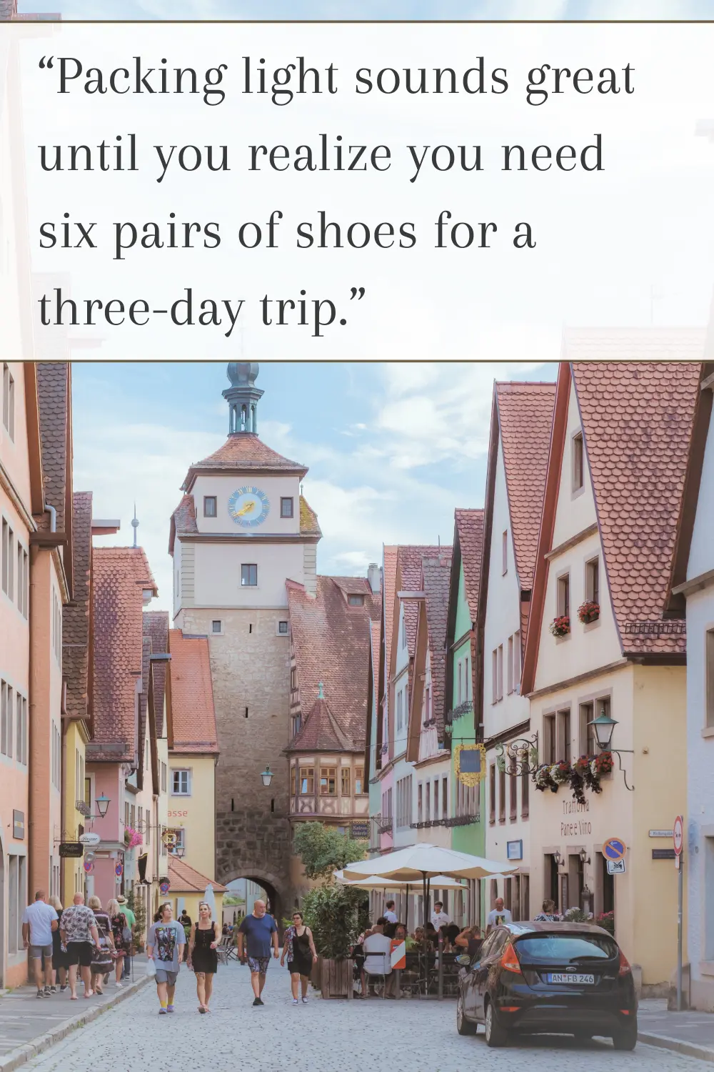 A lively European street with outdoor cafés, colorful buildings, and people walking.