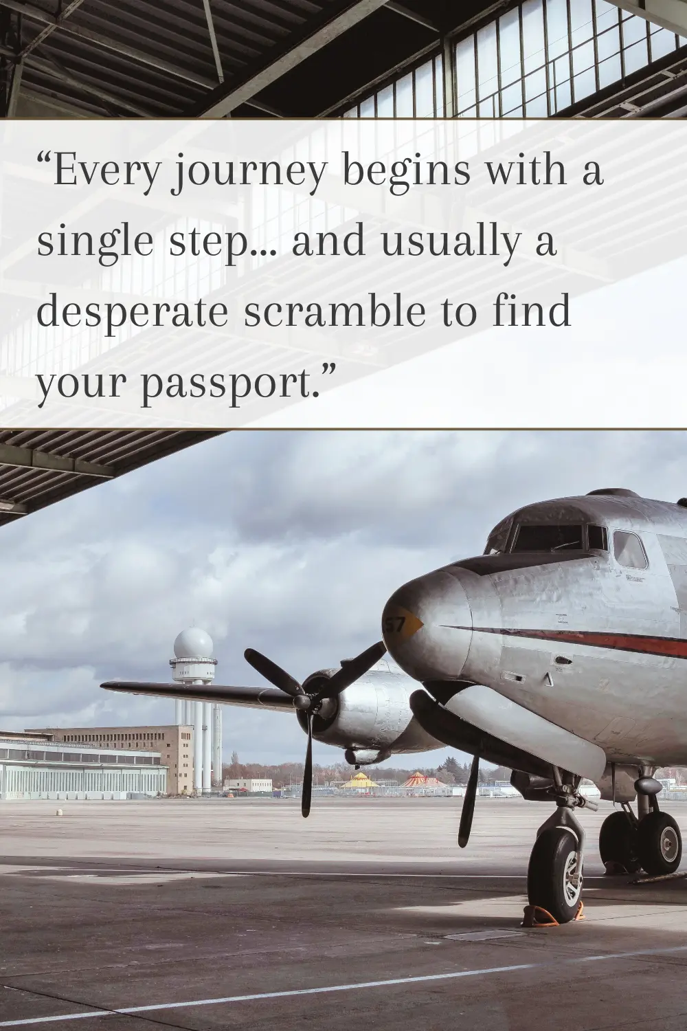 A historic airplane parked at an open airport hangar with cloudy skies.