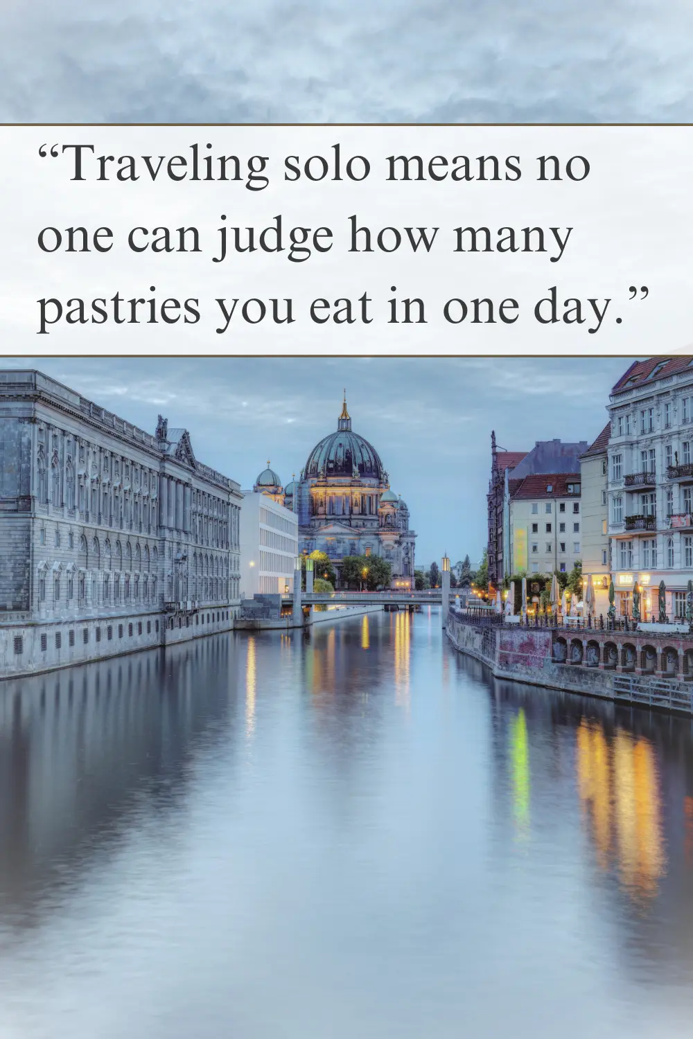 A beautifully lit cityscape at dusk with reflections on the river