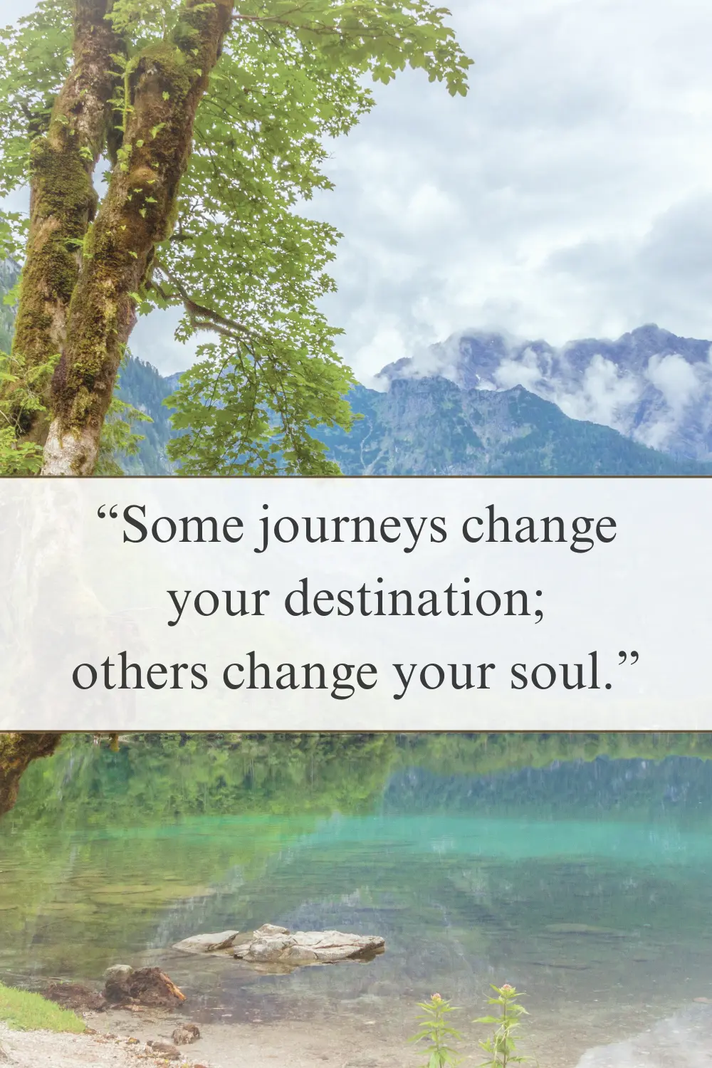 A peaceful mountain lake reflecting towering peaks and lush trees. 