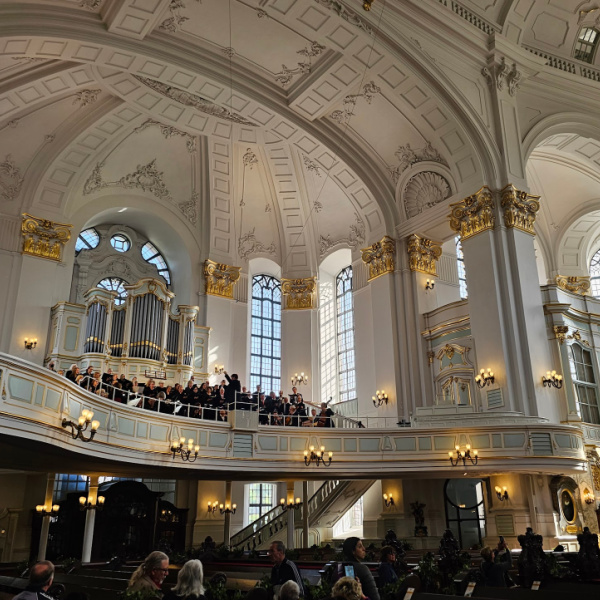 When one enters a church and unexpectedly finds the orchestra practicing.