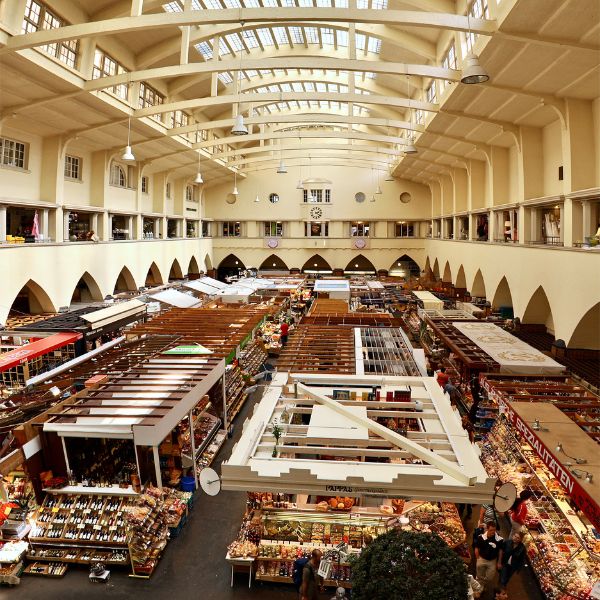Numerous stalls in a white building called the Market Hall in Stuttgart, Germany