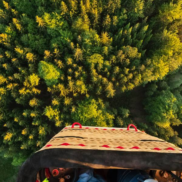 View from a hot air balloon basket high above the ground The stunning view of the landscapes from the balloon basket