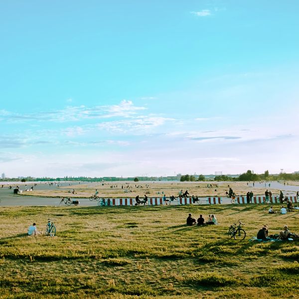 Tempelhof Park Airfield runway with people cycling and relaxing