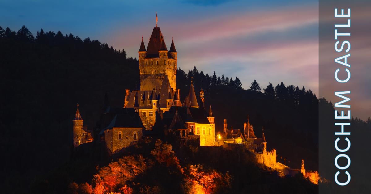 Cochem Castle lit up a glow at night Cochem Castle at night