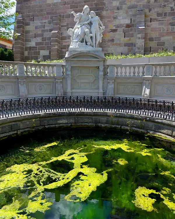 Donauquelle Close-up of Donauquelle spring waters with statue at the source of the Danube in Donaueschingen