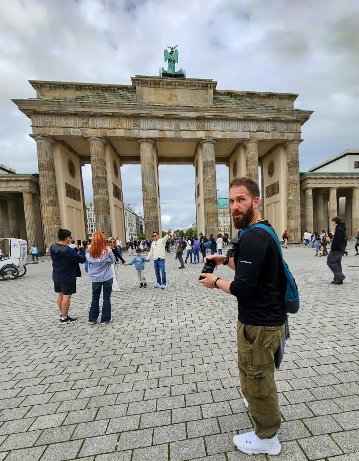 Posing with crowds at the Brandenburg Gate in Berlin