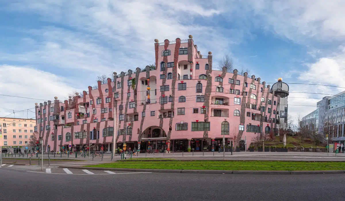 Green Citadel The Green Citadel of Magdeburg, colorful Hundertwasser-designed building with pink façade and uneven lines