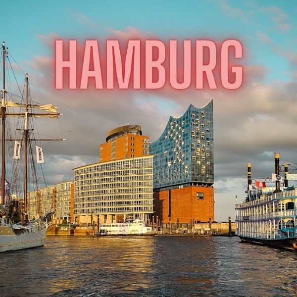 Hamburg text and harbour with glass building and boats