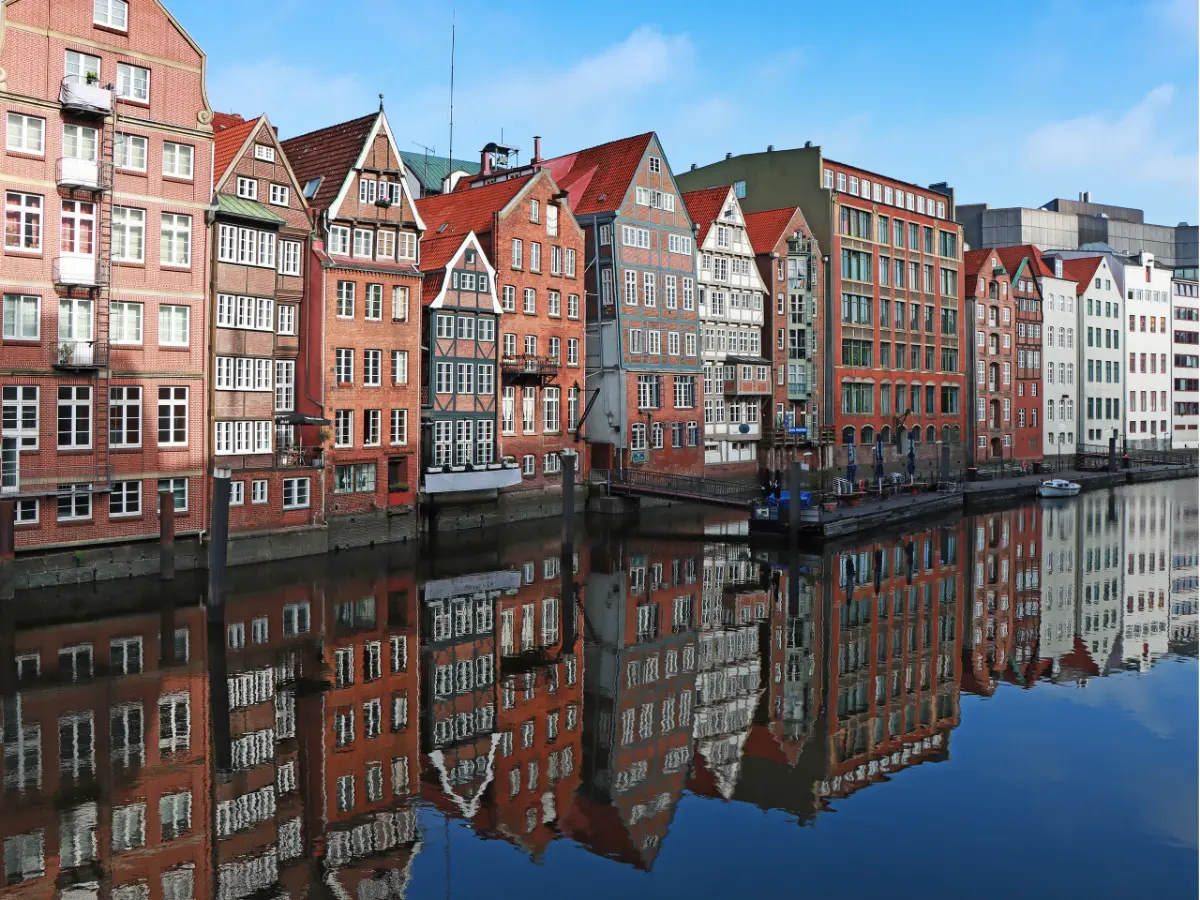 Red brick buildings line canal in Speicherstadt district in Hamburg