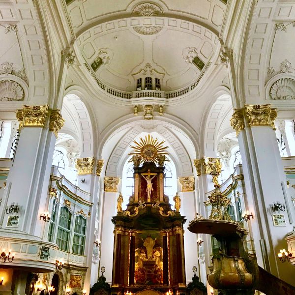 St. Michaels chuch altar and white walls with golden accents