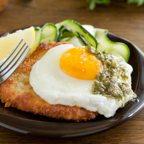 Holstien Schnitzel with fried egg and caper sauce.