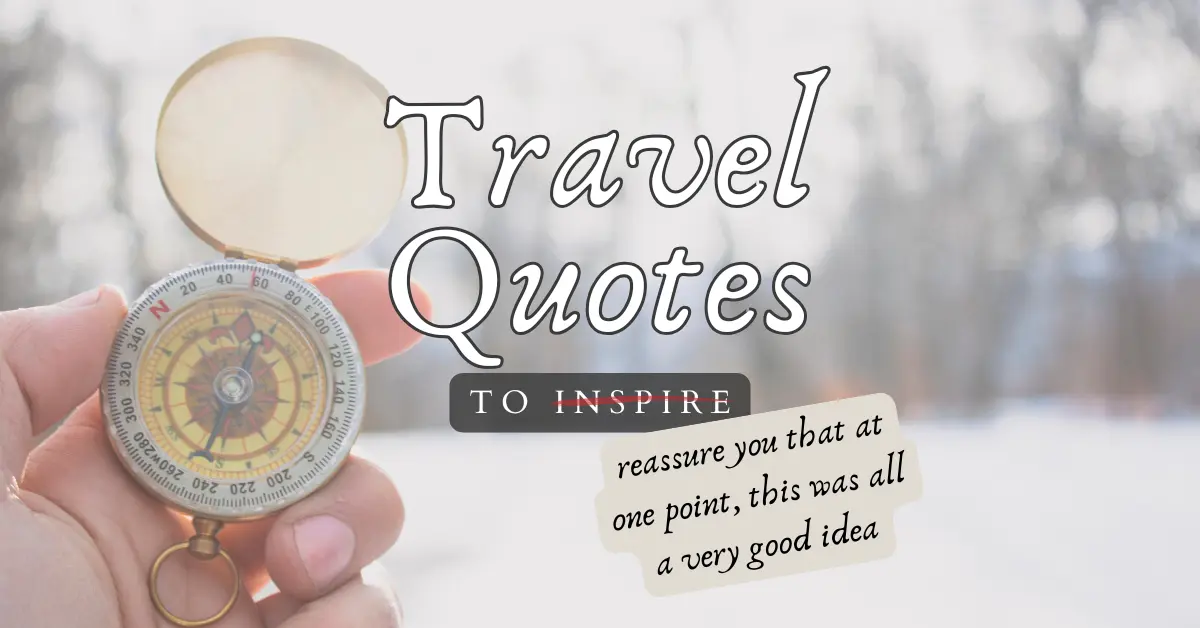 A hand holding a compass against white snowy background