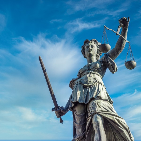 Statue of the Lady of Justice in Frankfurt Statue of woman holding a sword and scales in Frankfurt