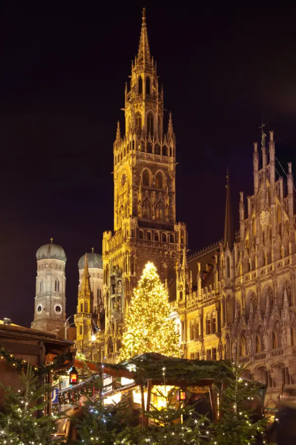 Munich Christmas Market in Marienplatz with a giant Christmas tree and Alpine holiday decorations.
