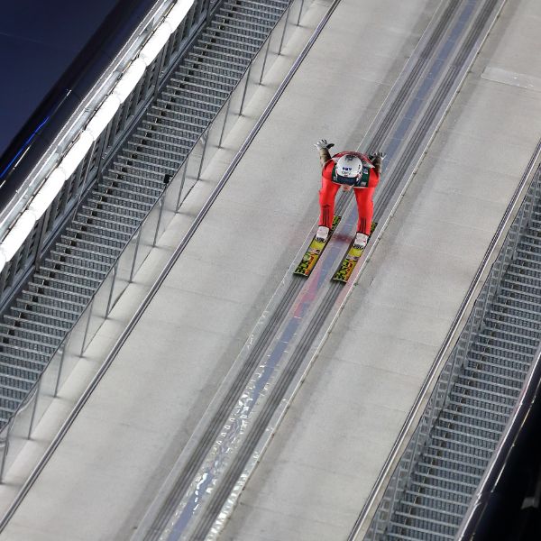 Ski jumper going down the inrun on a training jump at Oberstdorf, Germany Ski jumper going down the inrun on a training jump at Oberstdorf, Germany