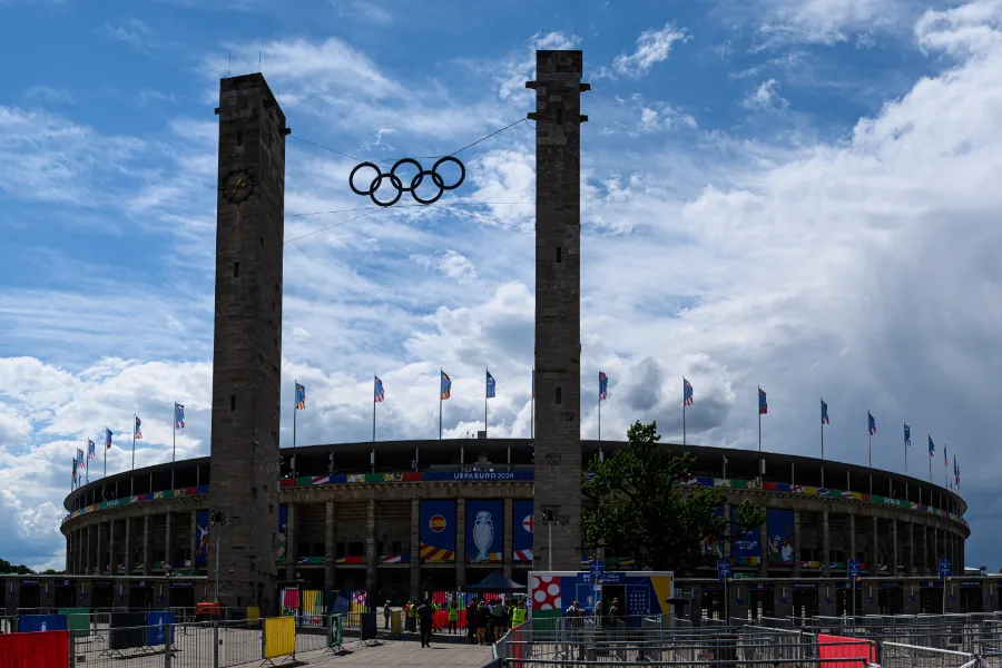 Olympic rings suspended between the entrance towers of the Olympiastadion in Berlin