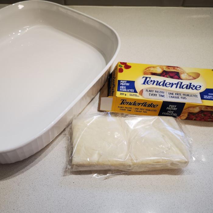 Preparing the puff pastry for the Zwiebelkuchen