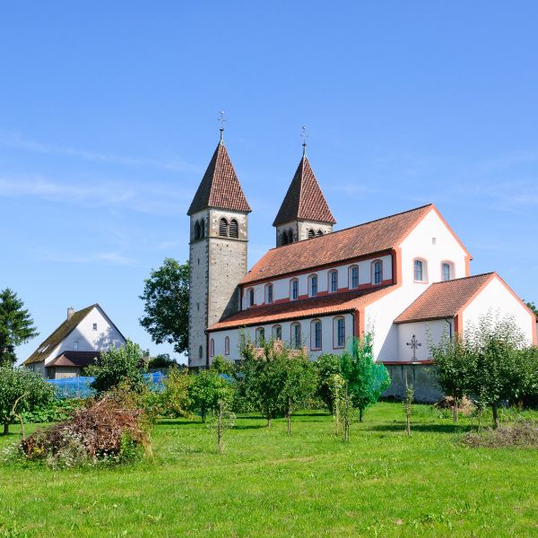 Church of St. Peter and Paul in Germany Twin-tower red roof church surrounded by green grass: Church of St. Peter and Paul in Germany