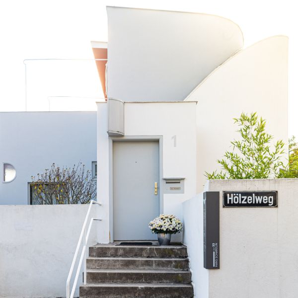 Steps leading up to white building known as the Weissenhof Estate in Stuttgart