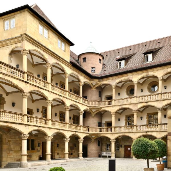Courtyard surrounded by pillars and balconies of the Altes Schloss in Stuttgart, Germany