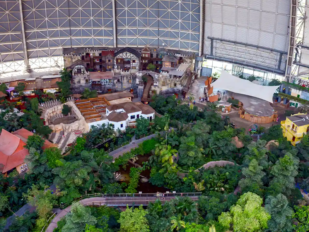 Aerial of Tropical Islands Resort rainforest under huge hangar roof—unique indoor escape in Brandenburg.