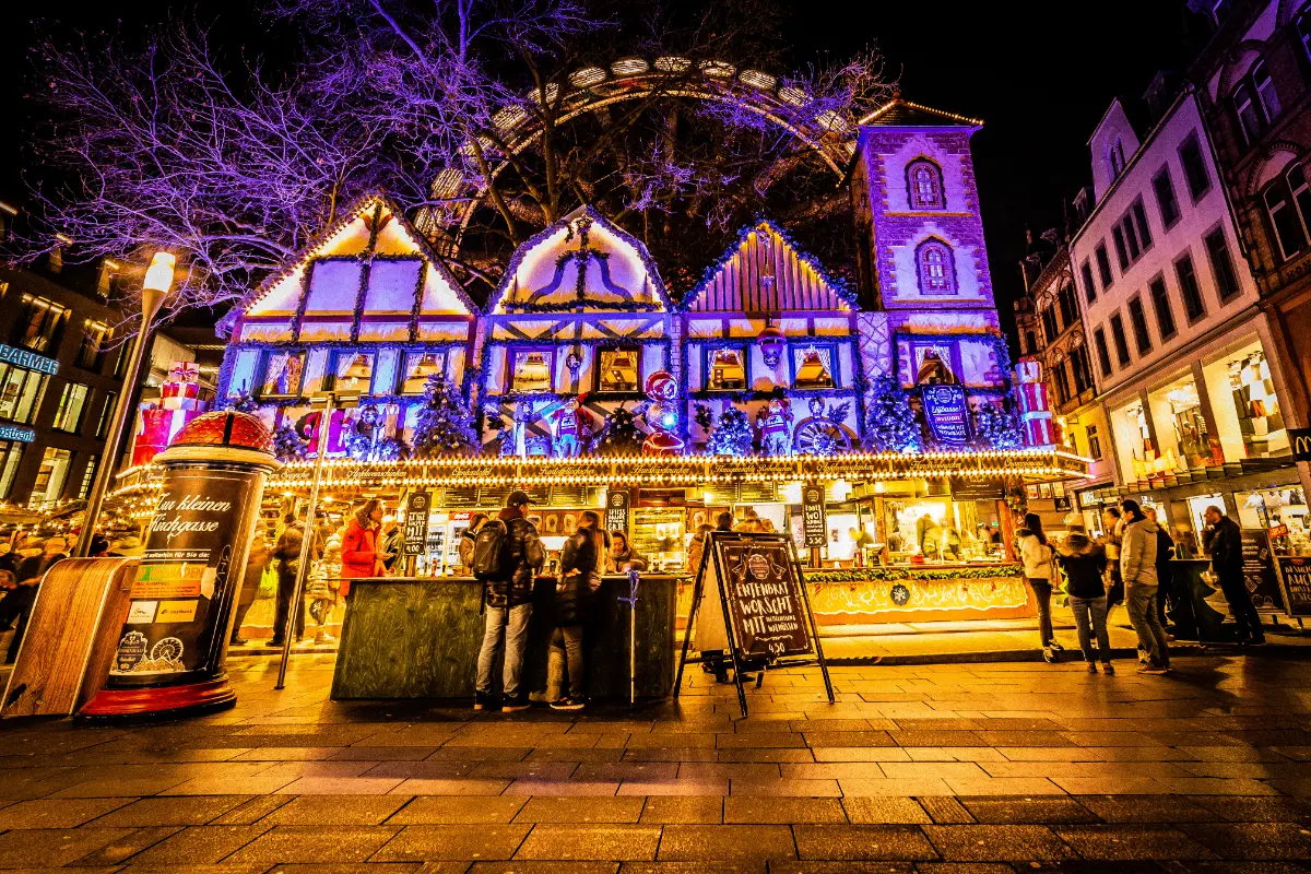 Wiesbaden Sternschnuppenmarkt with signature blue and gold lights and a historic Ferris wheel.
