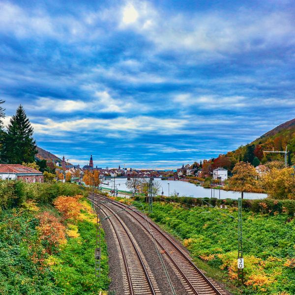 Railway through valley by river heading into Heidelberg