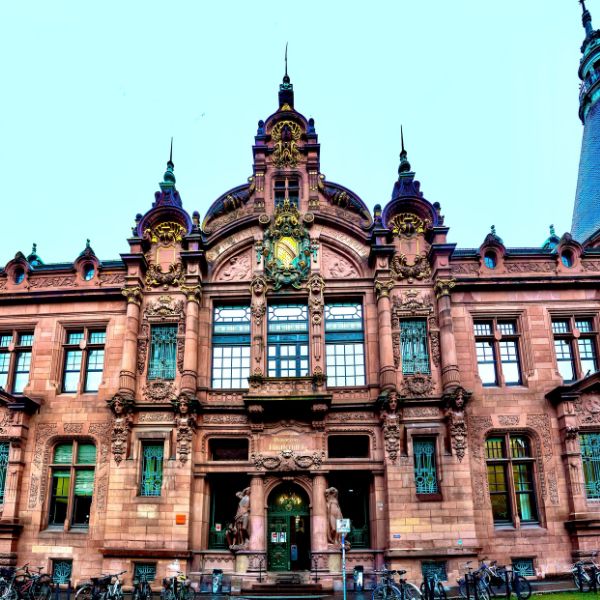 Red sandstone front of Heidelberg University with roof spires