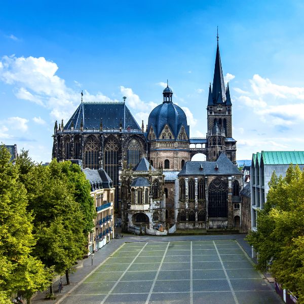 Aachen Cathedral by tree-lined street