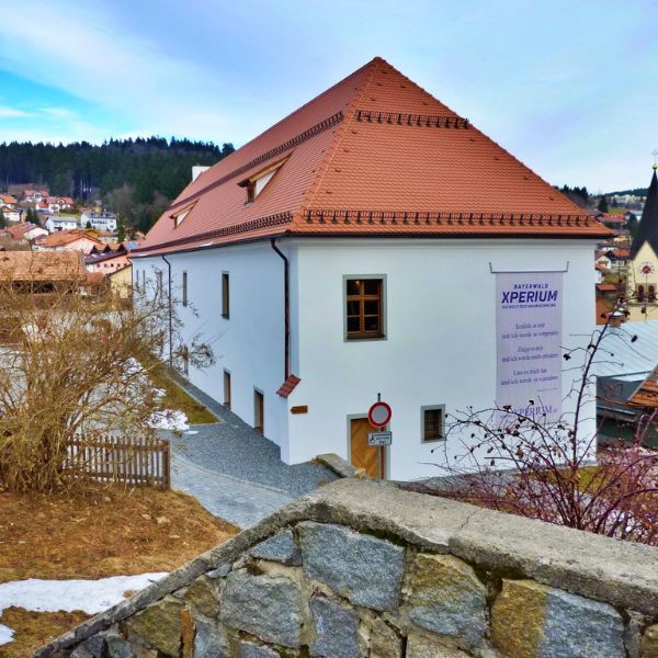 White building with red tile roof