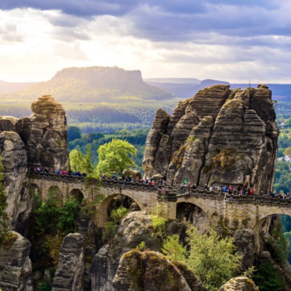 Stone bridge known as Bastei Bridge spanning tall natural rock towers at the Swiss National Park, Dresden