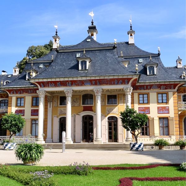 Four-pillared Pillnitz Palace with manicured gardens in Dresden