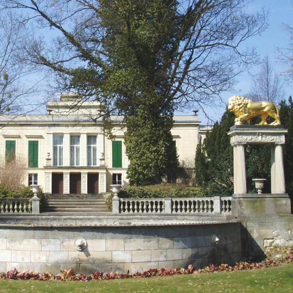 Glienicke Palace grounds with golden lion statues