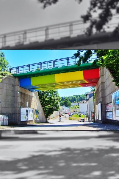 Concrete railway bridge painted as brightly coloured Lego bricks in Wuppertal, Germany