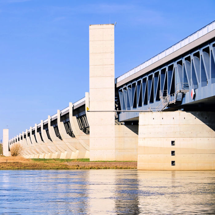 The Magdeburg Water Bridge is a remarkable engineering marvel, a navigable aqueduct that spans the Elbe River, allowing ships to cross above the water.