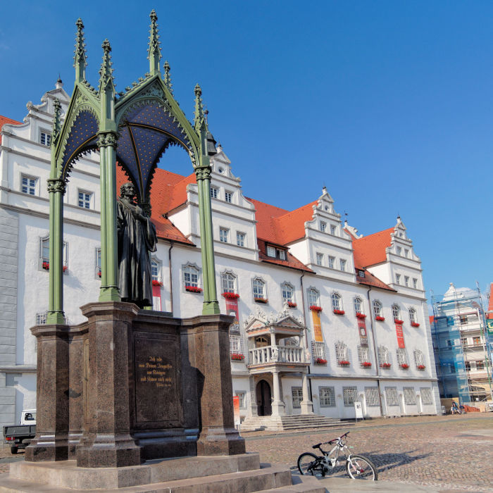 The Luther statue and the town hall of Wittenberg, Germany